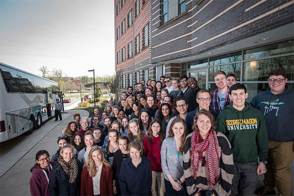A large group of students from the High School Student Internship Program pose for a photo.