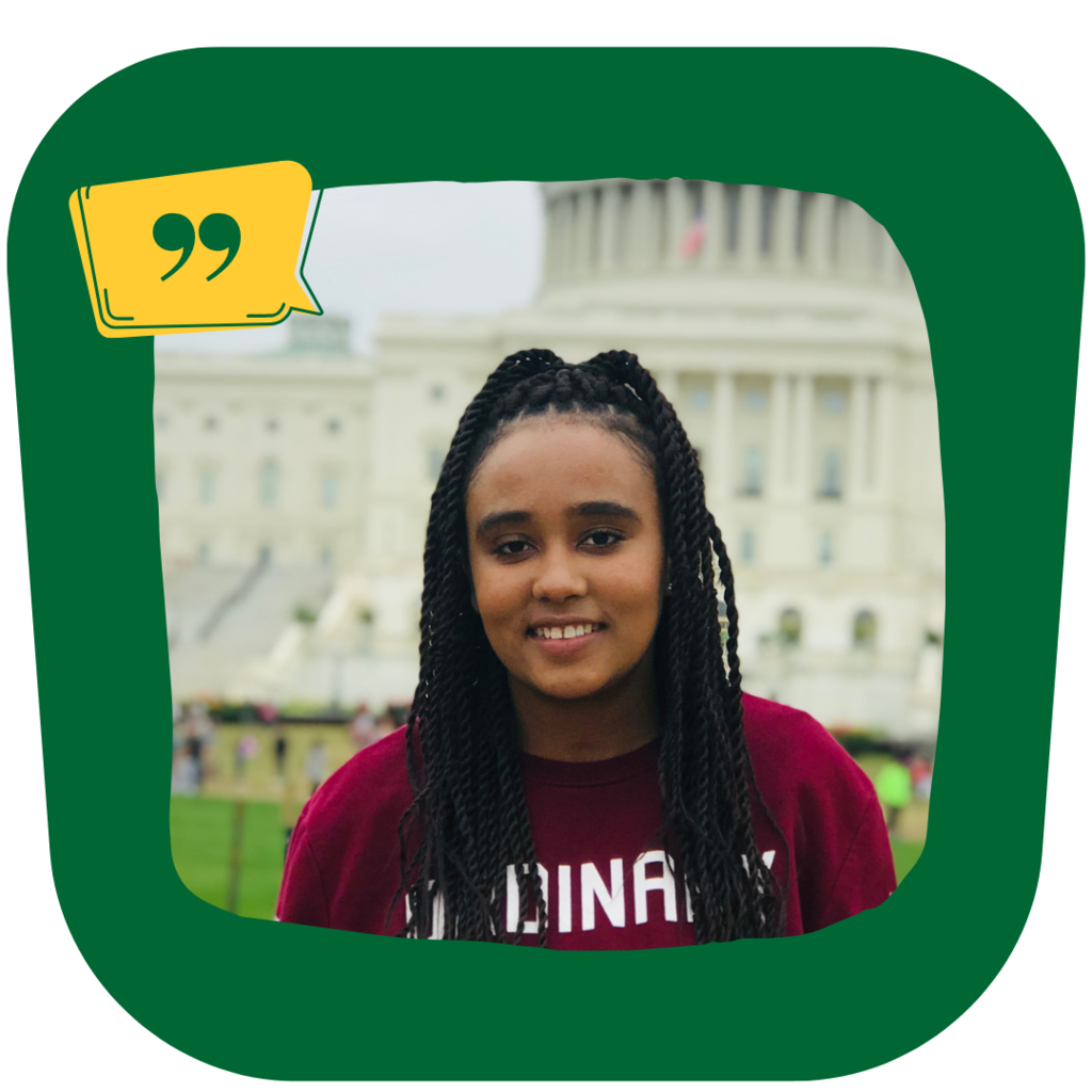 MPA graduate Meron Aboye, young black woman stands in front of the U.S. capitol building, smiling at the camera.