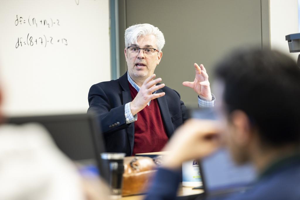 Associate Professor Delton Daigle teaches to his class.