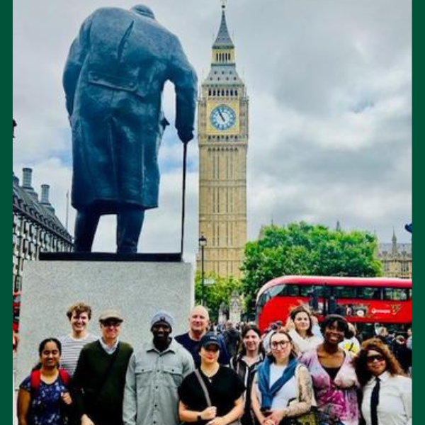 Schar School students stand with the dean in front of Big Ben in London.