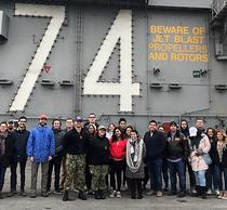 Schar School students and faculty tour the USS Stennis flight deck