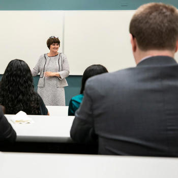 Photo of Anne Holton lecturing to a class