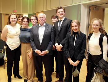Members of the Schar School of Policy and Government’s Democracy Lab and former CIA director John Brennan